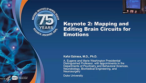 slide features the title "Keynote 2: Mapping and Editing Brain Circuits for Emotions" by Kafui Dzirasa, M.D., Ph.D., a distinguished professor at Duke University. It is part of the National Institute of Mental Health’s 75th-anniversary event, with a blue background and a circular logo celebrating 75 years of research and discovery.