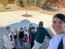 Alexander, Clara, Justine, Sydney, Corey Plate, Dr. Kao, Dr. Blay-Tofey, and Dr. Lopez-Guzman enjoying the fall foliage at Lake Artemesia.